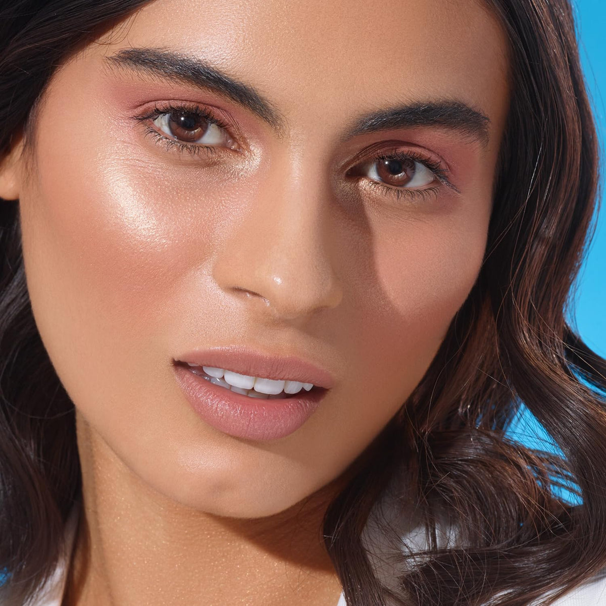 Physicians Formula palette being applied to cheek showing buildable color and luminous finish