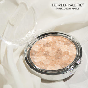 Brush applying Physicians Formula Light Bronze Pearl to cheek demonstrating subtle glow and easy application