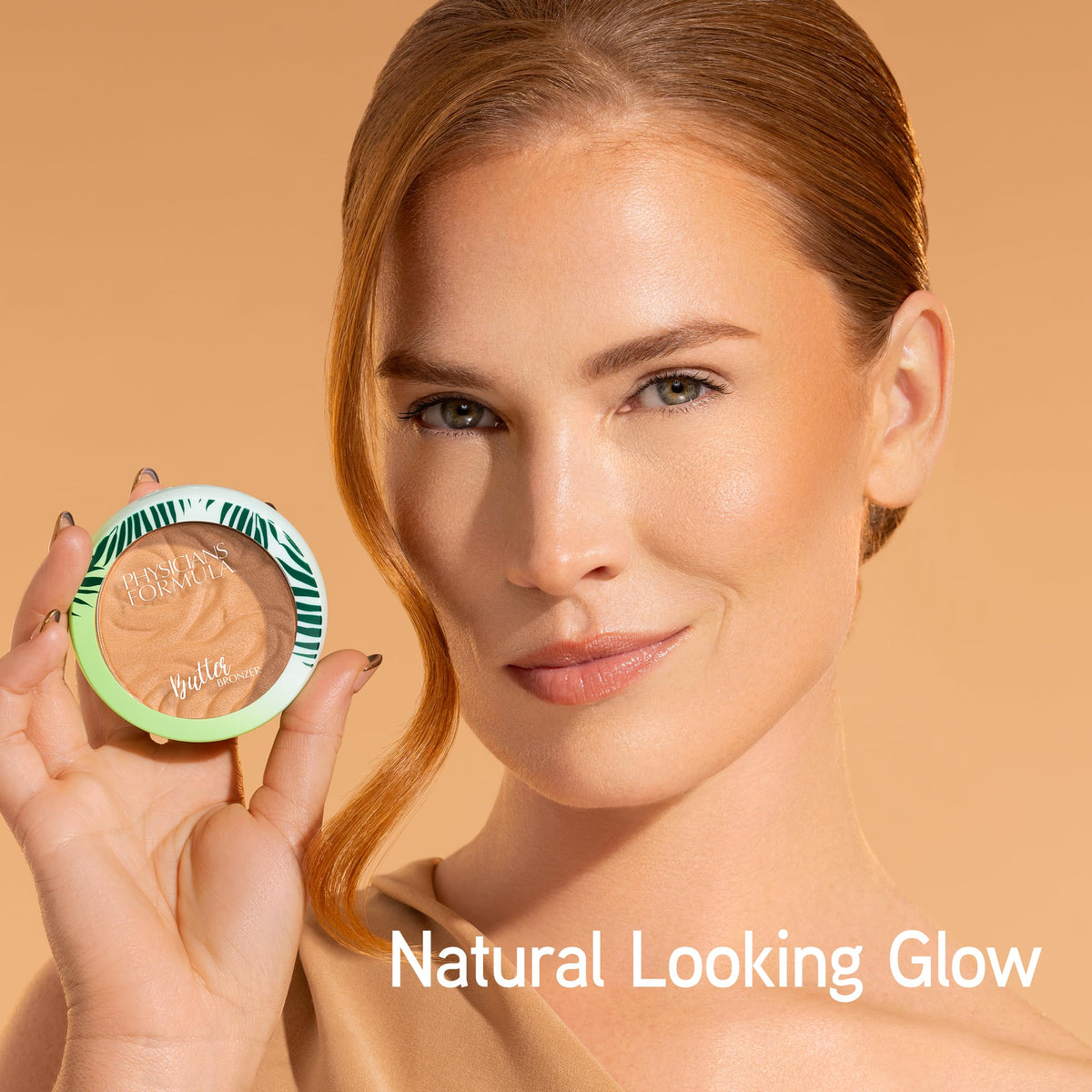 Physicians Formula bronzer close-up swirl detail revealing buttery pigments and luminous sheen