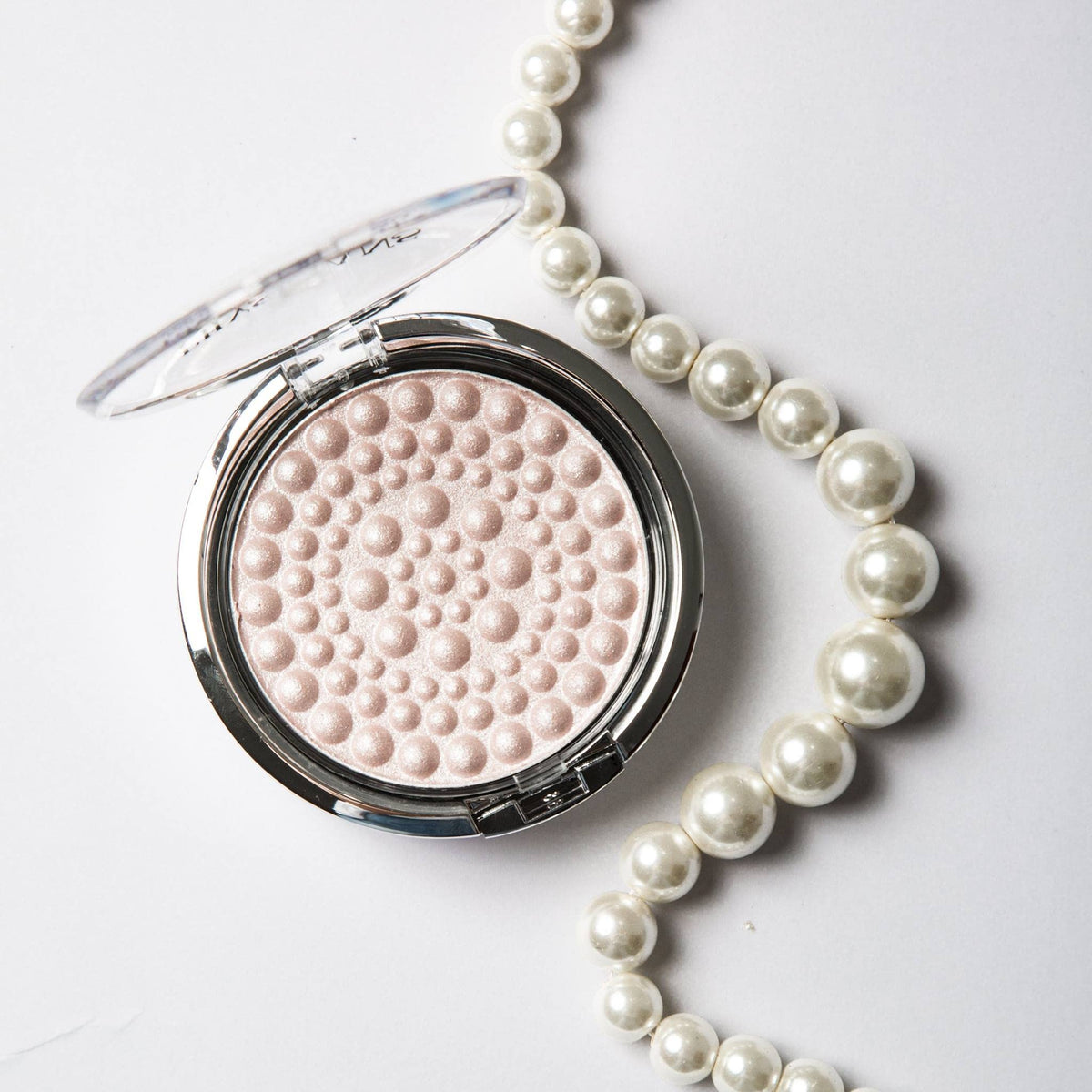 Physicians Formula swatched on skin demonstrating soft radiance and even tone benefit