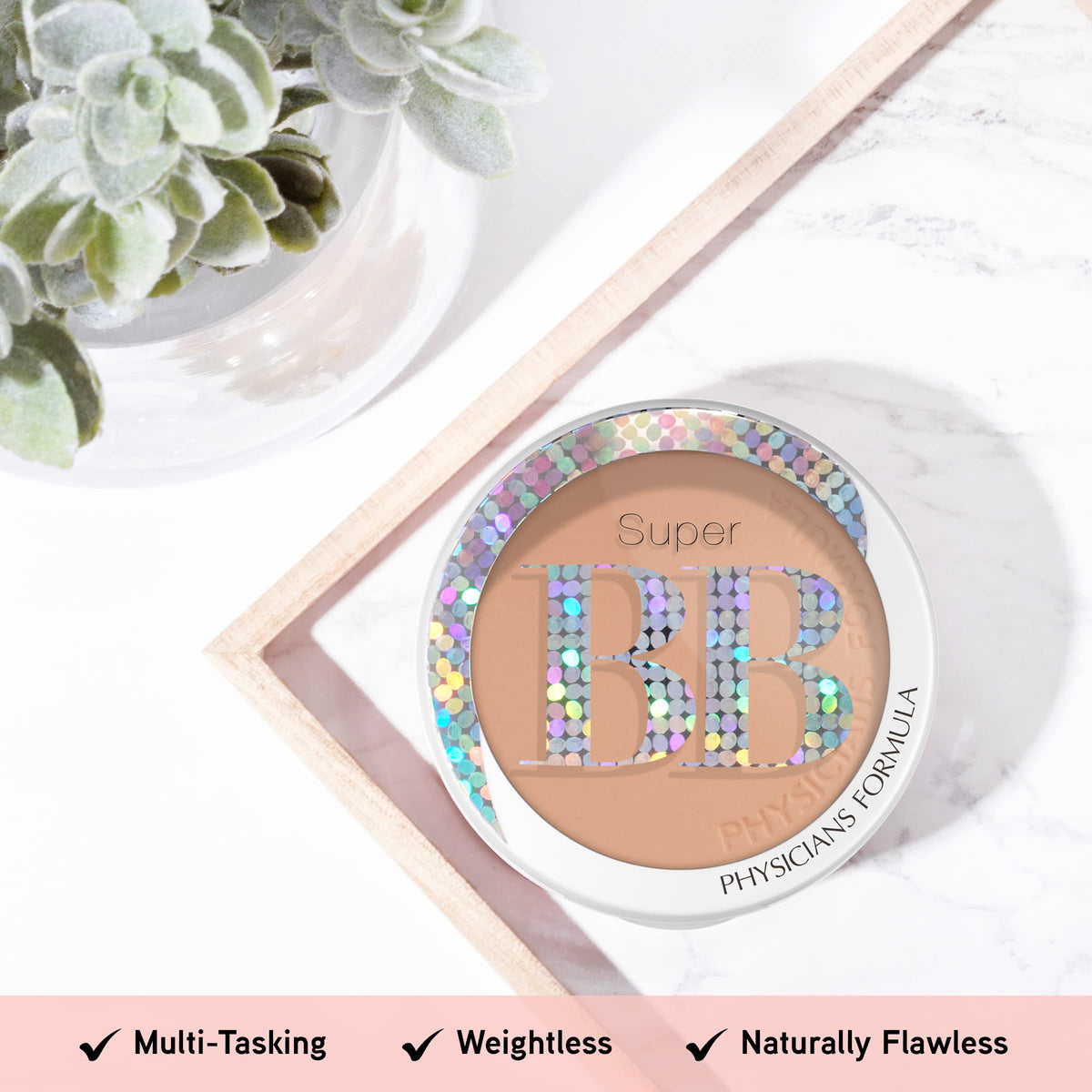 Physicians Formula compact held in hand for size scale, easy travel convenience benefit