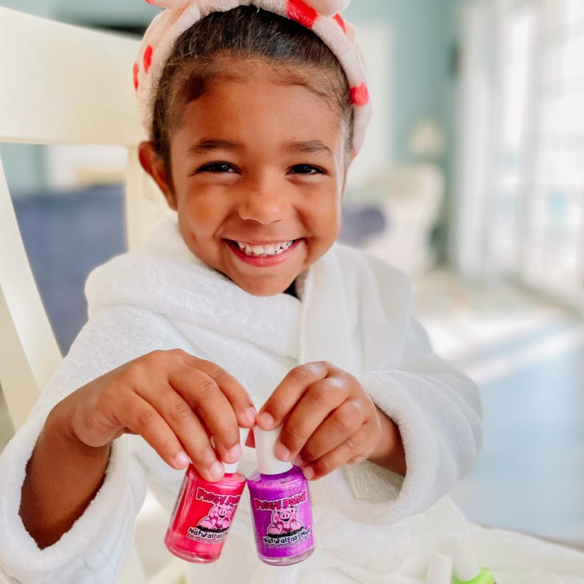 Piggy Paint being applied to a child's nails, demonstrating gentle use