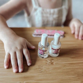 Child holding Piggy Paint bottle showing family-friendly safety