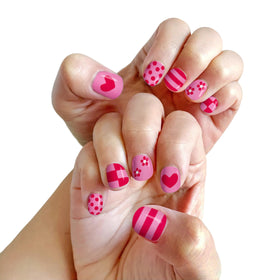 Family giving at-home manicure using Piggy Paint for a relaxed, creative moment