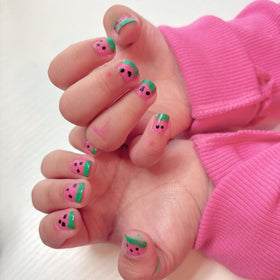Children's hands being painted with Piggy Paint Forever Fancy demonstrating safe use