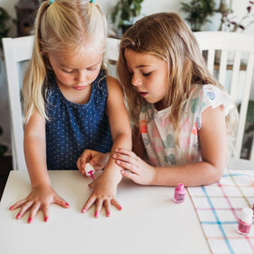 Piggy Paint gift box styled on table to show presentable, family-friendly gift set