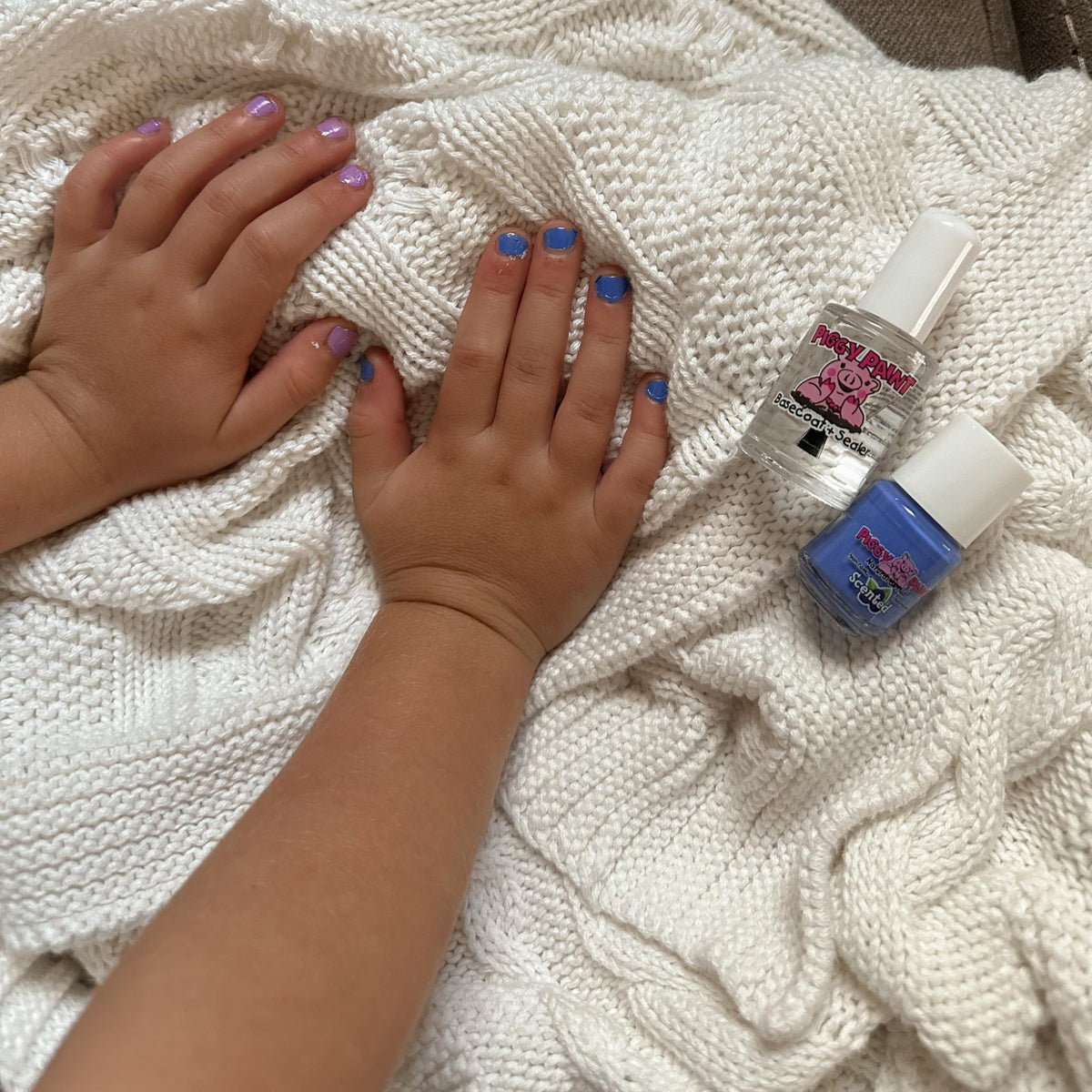 Mom and child painting nails with Piggy Paint for easy bonding