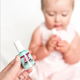 Piggy Paint being applied to a child's nails demonstrating easy, controlled brushwork