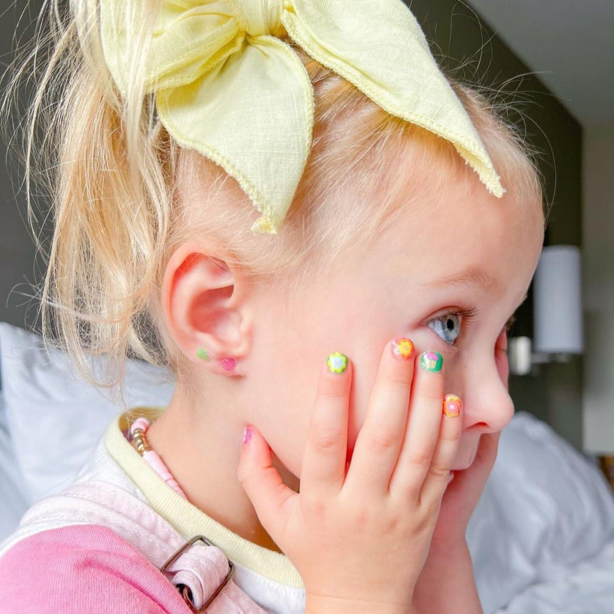 Piggy Paint stick-and-stay earrings shown separately to add playful accents