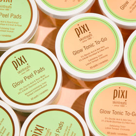Applying Pixi Glow Tonic pad to neck and décolleté to demonstrate gentle brightening action