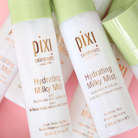 Pixi Milky Mist misting over makeup to revive dewy finish