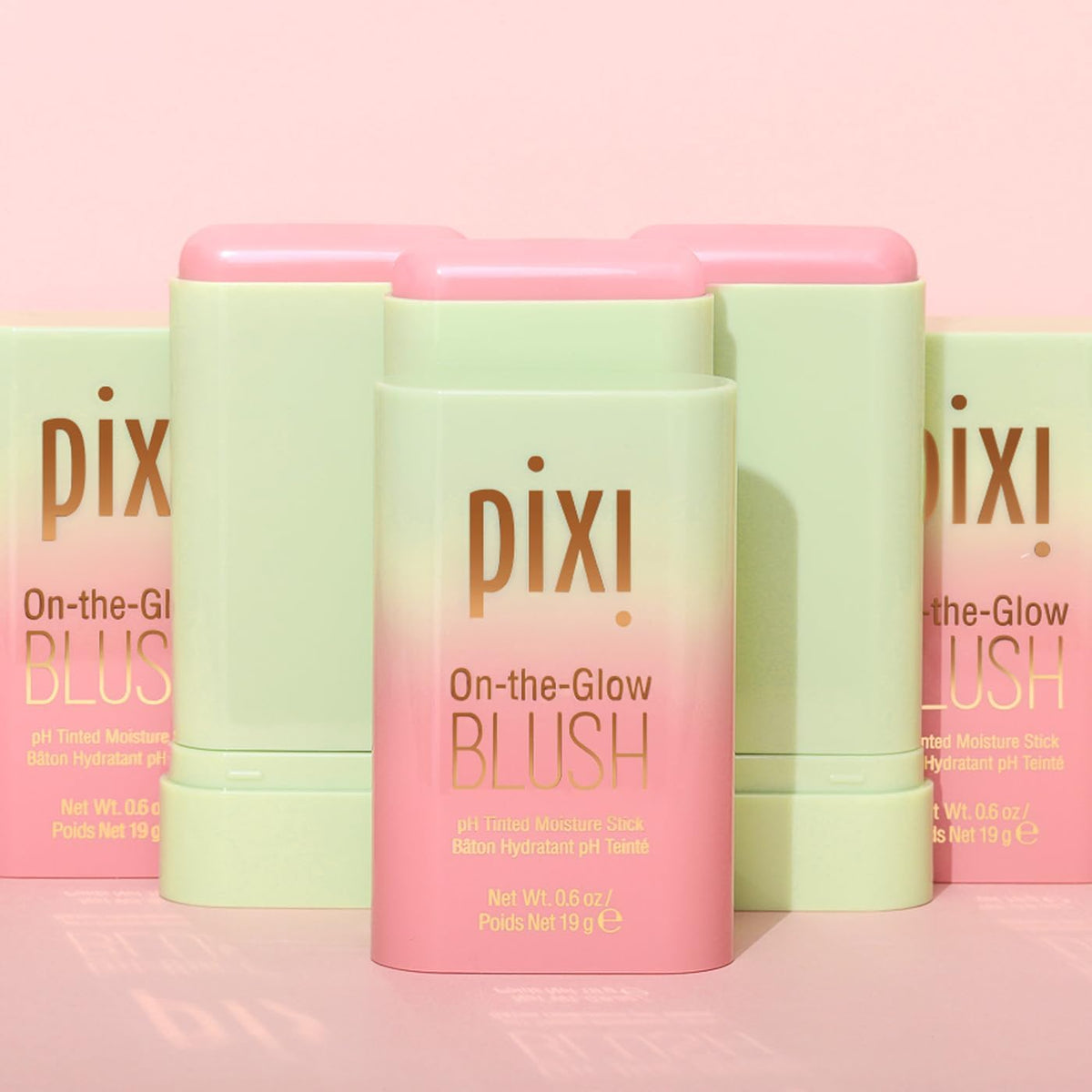 Model applying Pixi blush stick to cheeks for dewy, fresh-faced finish