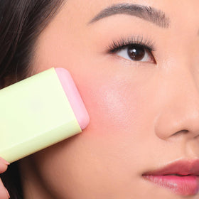 Close-up of soft creamy texture on fingertip, Pixi providing hydrating blend
