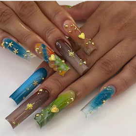 Pizadix hand applying charms demonstrating easy nail art application