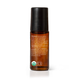 Plant Therapy roll-on on a bathroom shelf in a calming bathroom setting for routine care