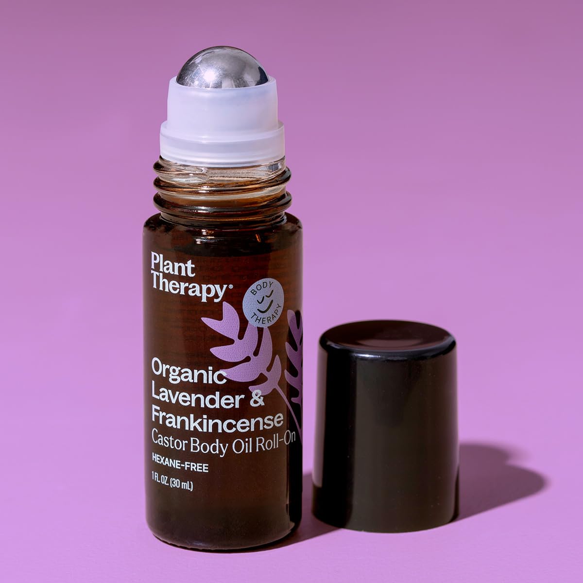 Plant Therapy raw lavender and frankincense botanicals beside bottle showing pure ingredients benefit