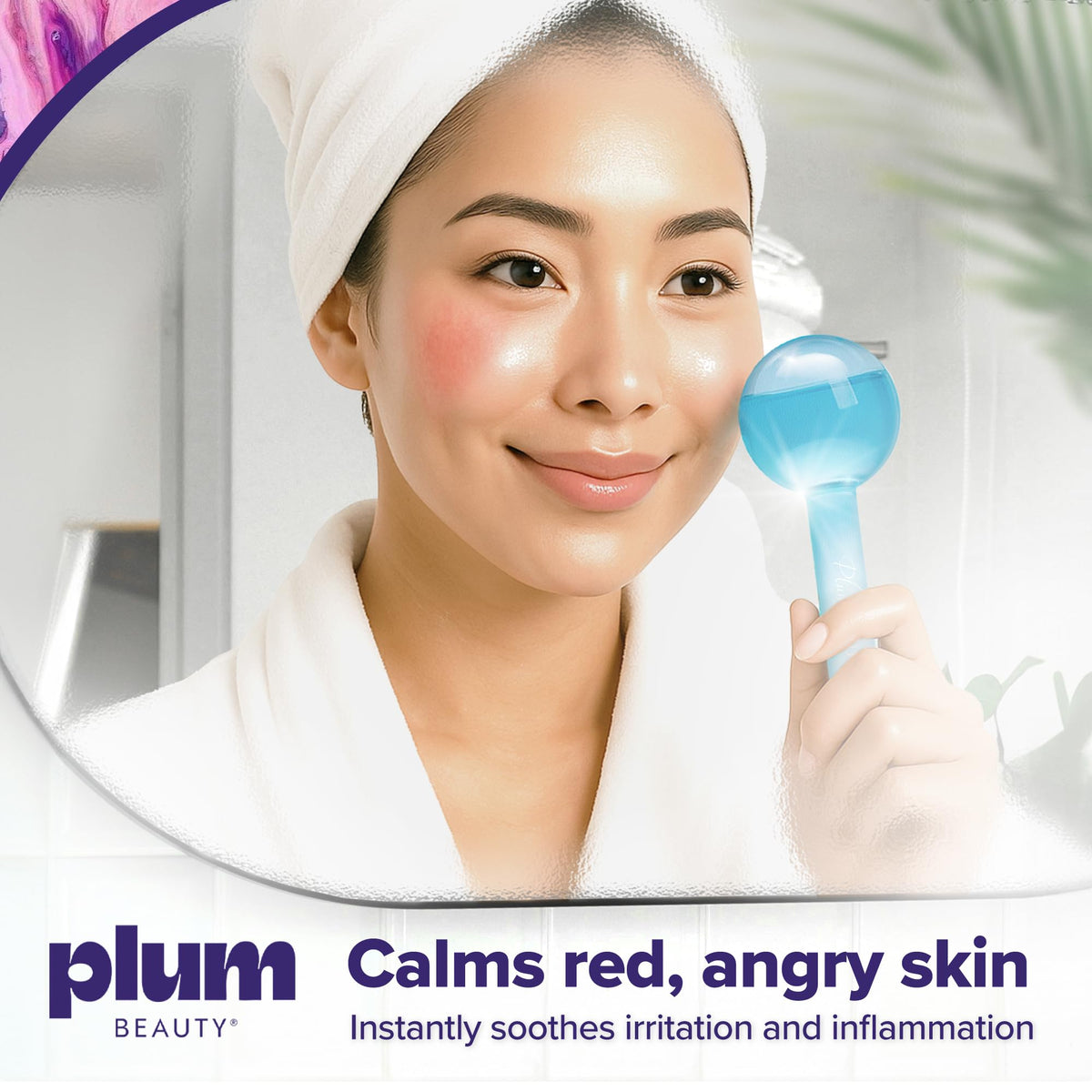Plum Beauty globes held in hand demonstrating size and ergonomic comfort for precise massage