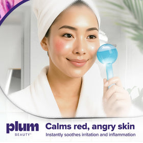 Plum Beauty globes held in hand demonstrating size and ergonomic comfort for precise massage