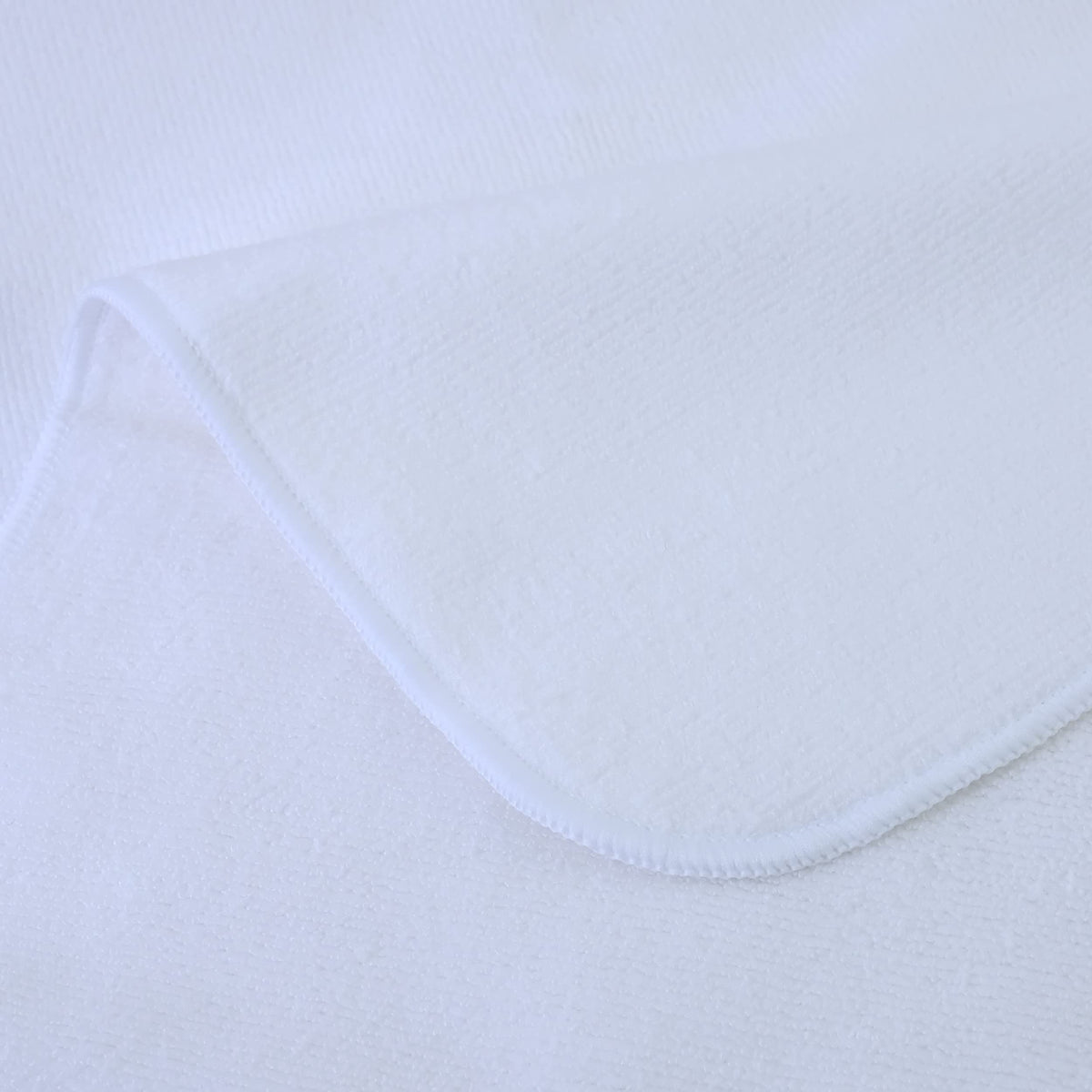 POLYTE towel beside hand showing 20 x 40 inch scale and coverage