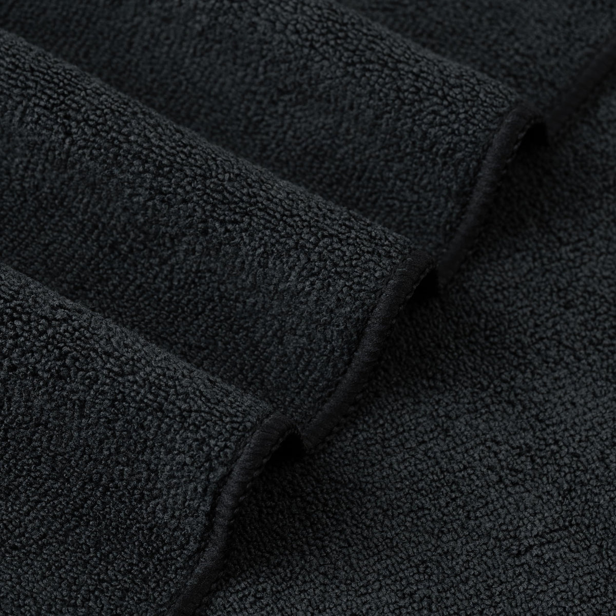 POLYTE two towels stacked in bathroom lifestyle for quick rotation