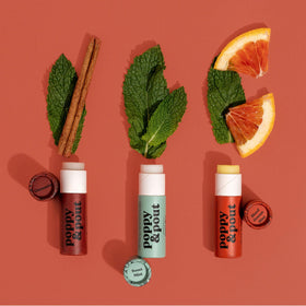 Poppy & Pout ingredients display with beeswax and coconut oil emphasizing natural formulation