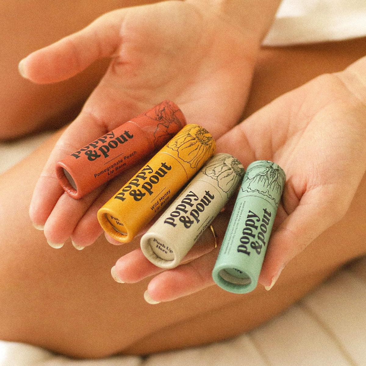 Poppy & Pout application on lips illustrating non-greasy hydration benefit