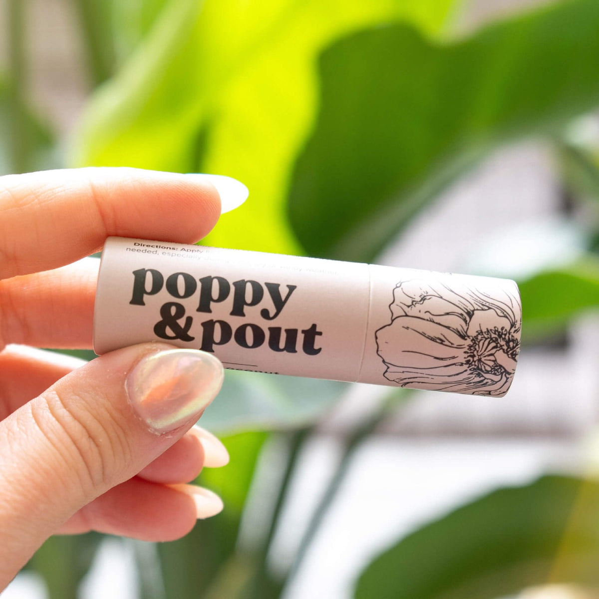 Poppy & Pout lifestyle beach setting evoking tropical fragrance and freshness