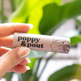 Poppy & Pout lifestyle beach setting evoking tropical fragrance and freshness