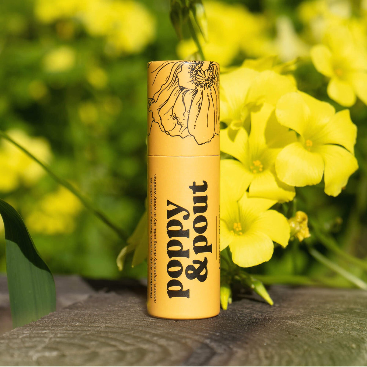 Poppy & Pout in-hand application demonstrating easy glide and long-lasting moisture