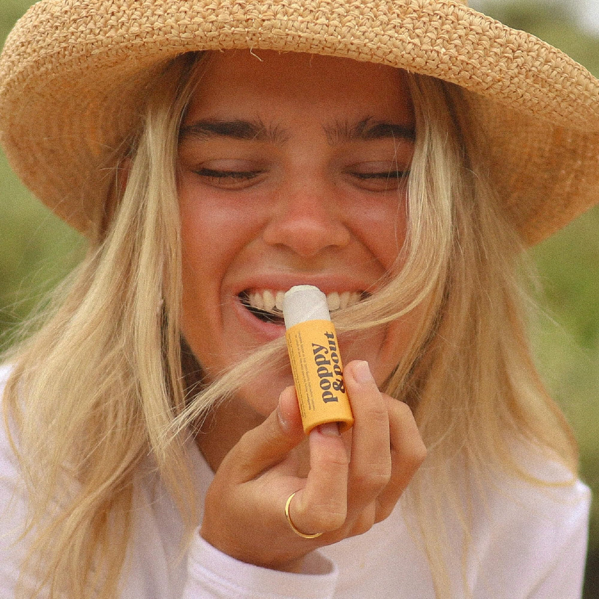 Poppy & Pout balm texture close-up highlighting smooth beeswax hydration