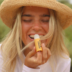 Poppy & Pout balm texture close-up highlighting smooth beeswax hydration