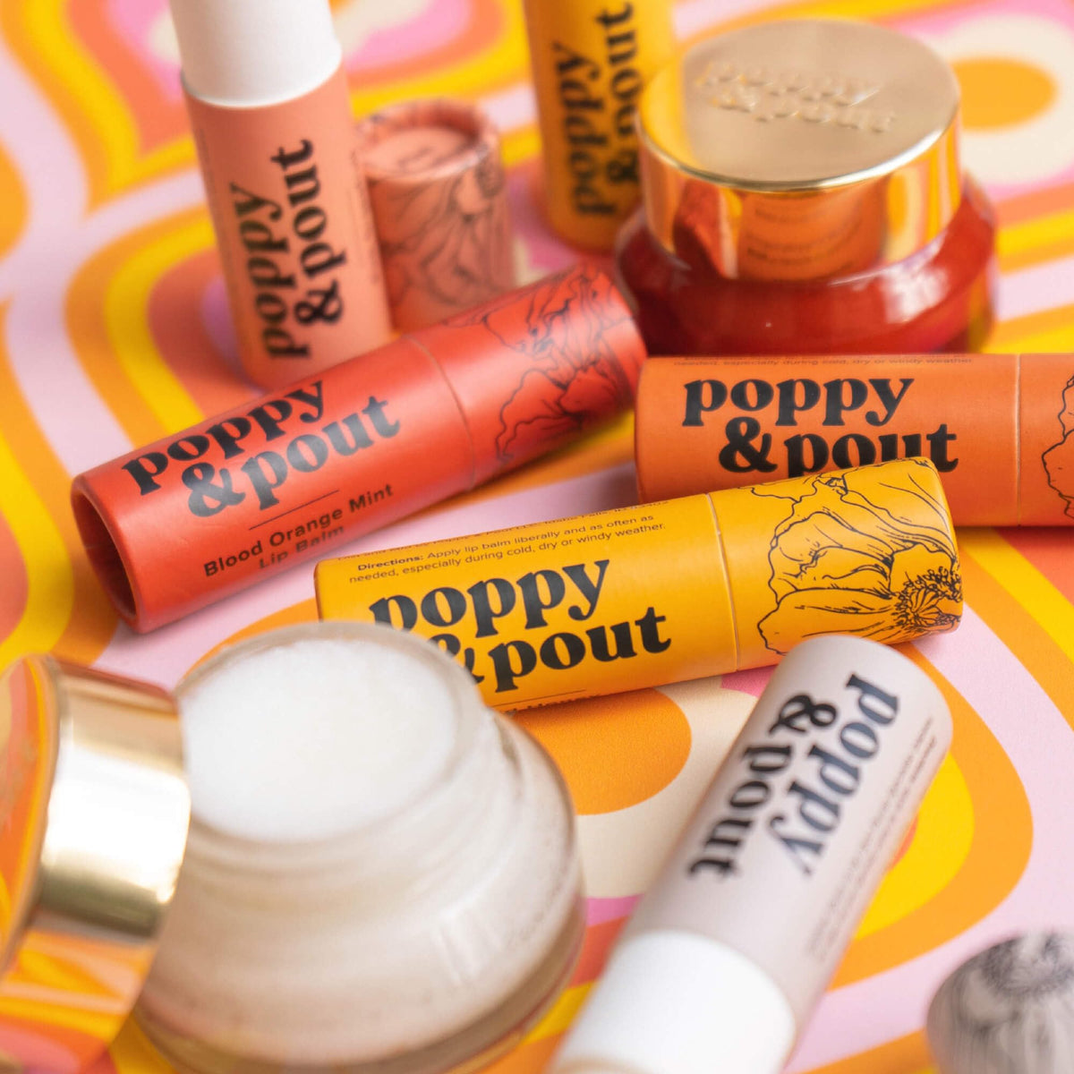 Poppy & Pout on nightstand beside pillow indicating overnight moisturization benefit