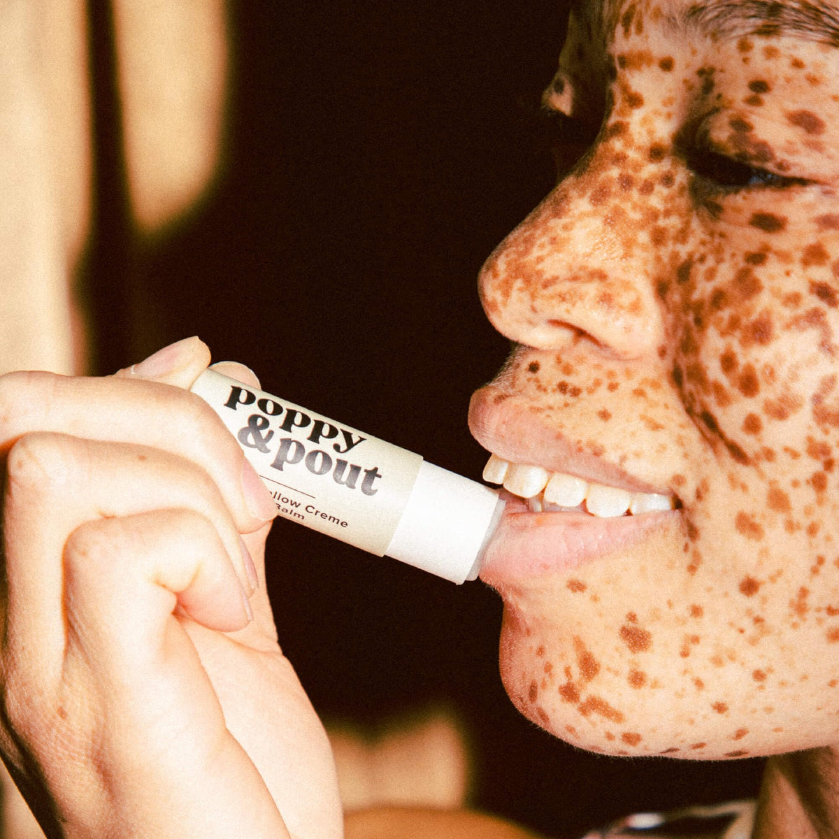 Poppy & Pout texture close-up on lips showing creamy glide and instant softness
