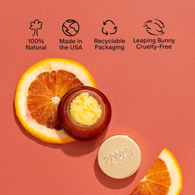 Poppy & Pout jar beside a coin showing compact size and travel convenience