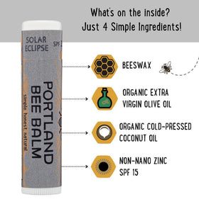 Applying Portland Bee Balm to lips for hydration and wind protection