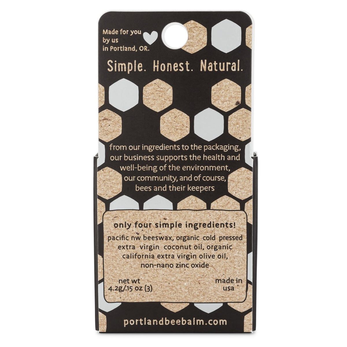 Portland Bee Balm open tube showing smooth beeswax texture and moisturizing effect