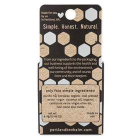 Portland Bee Balm open tube showing smooth beeswax texture and moisturizing effect