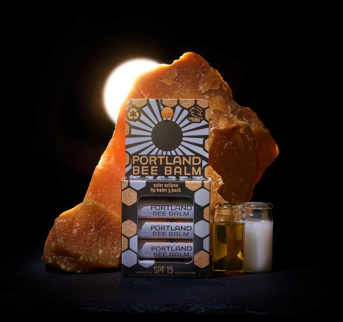 Three-pack of Portland Bee Balm Solar Eclipse arranged for travel convenience