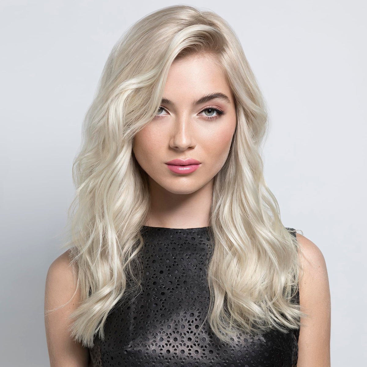 PRAVANA spray applied to damp hair demonstrating easy use
