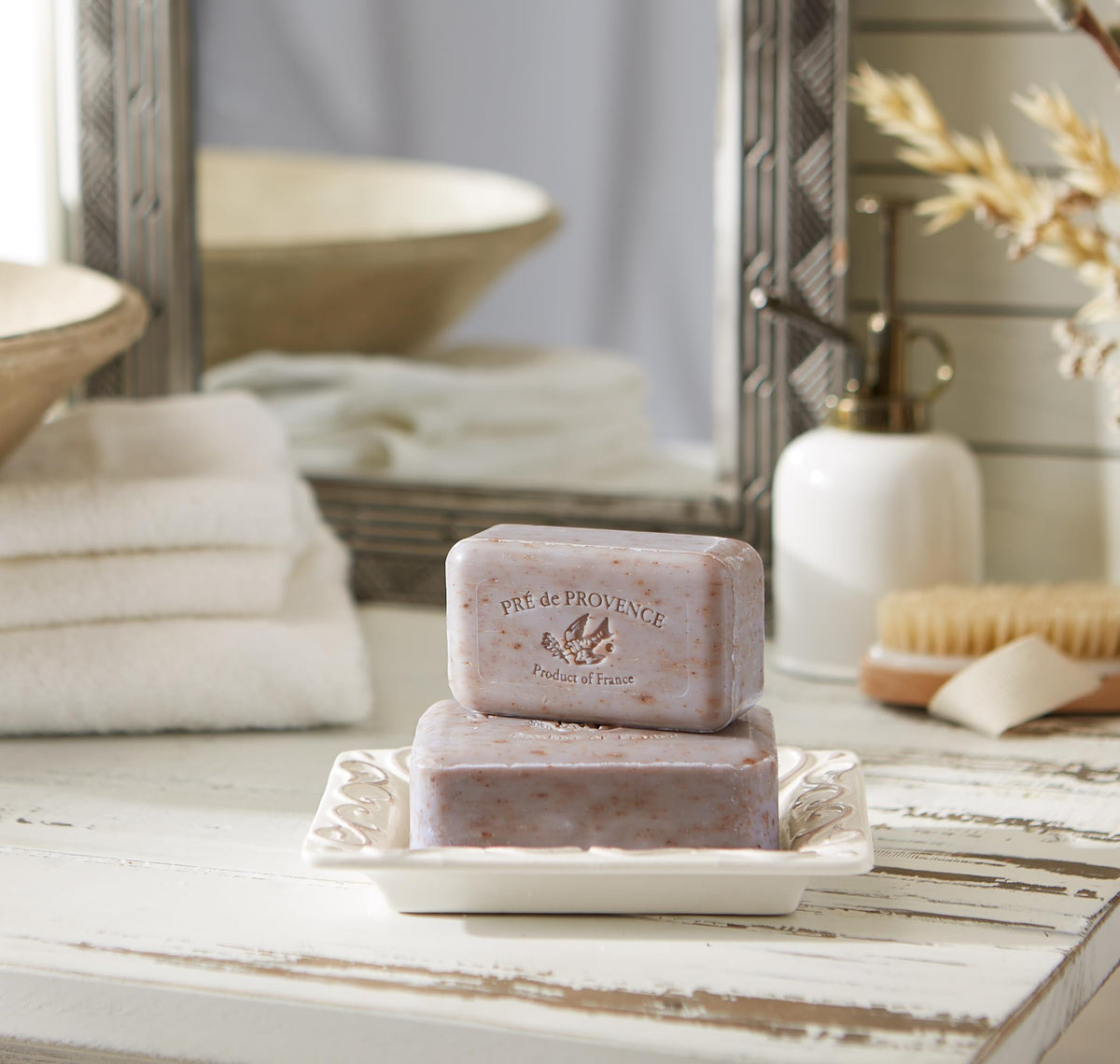 Pré de Provence lather in hand producing rich foam that gently cleanses skin