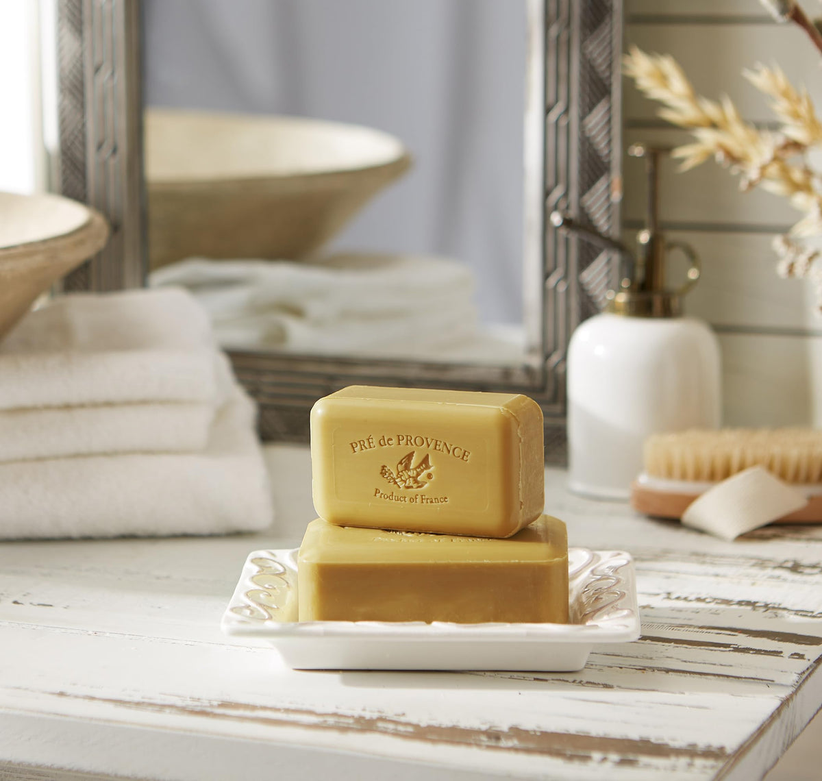 Pre de Provence soap held in hand showing true 8.8 oz scale and usability