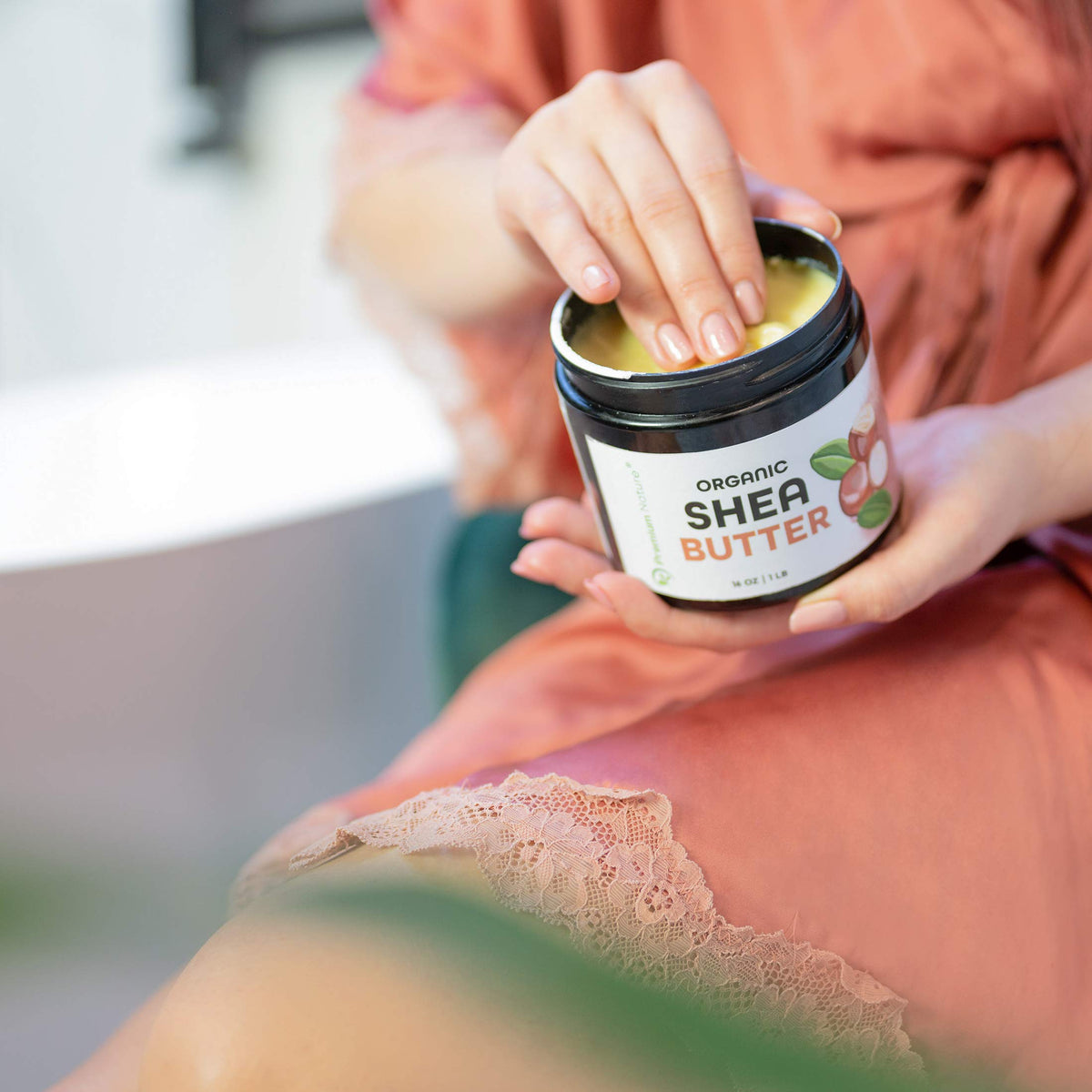 Premium Nature 16 oz jar beside common household items showing size and scale
