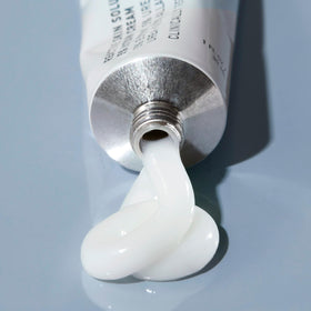 Prequel jar held in hand showing size for travel and everyday use
