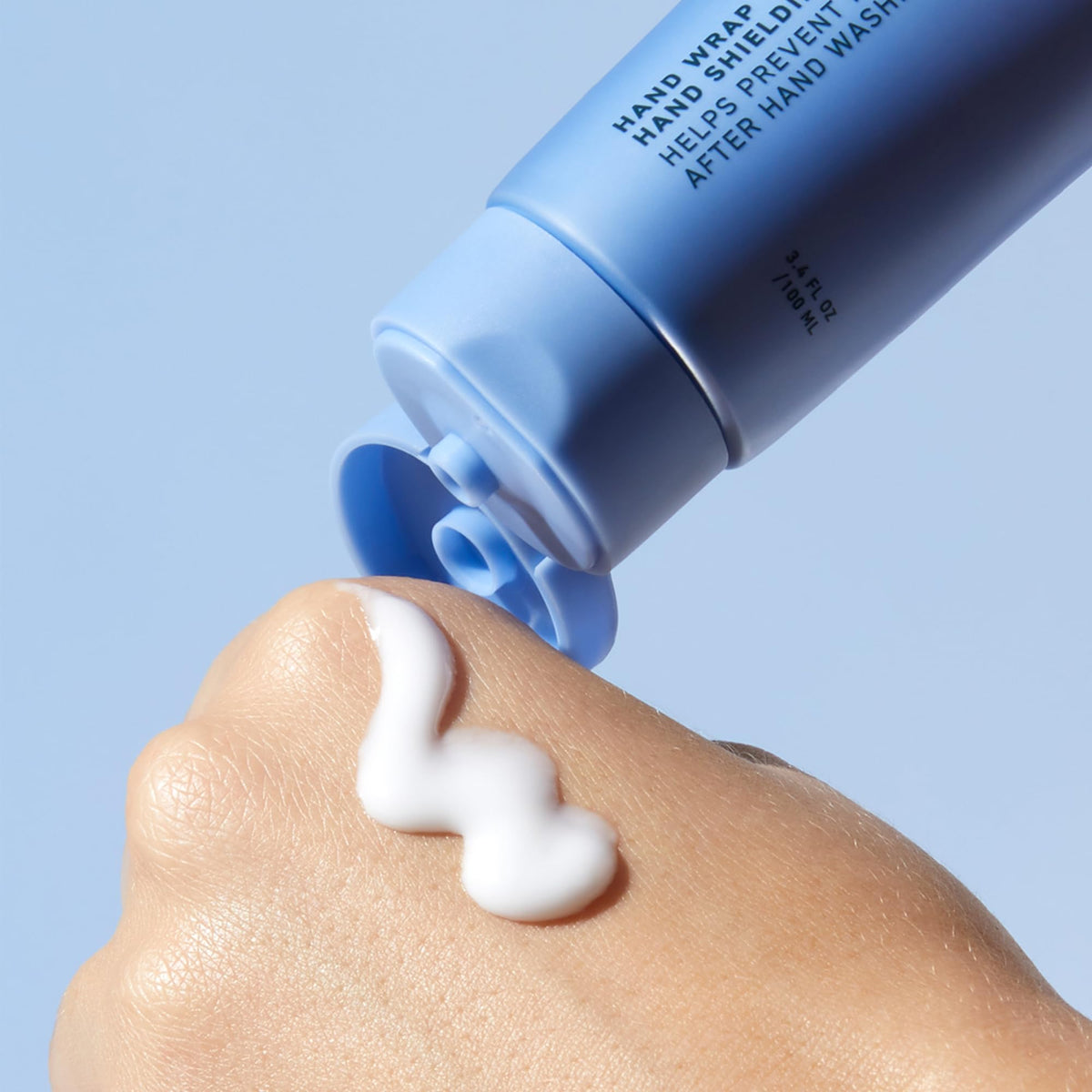 Prequel next to a smartphone to show 3.4oz travel-ready size benefit