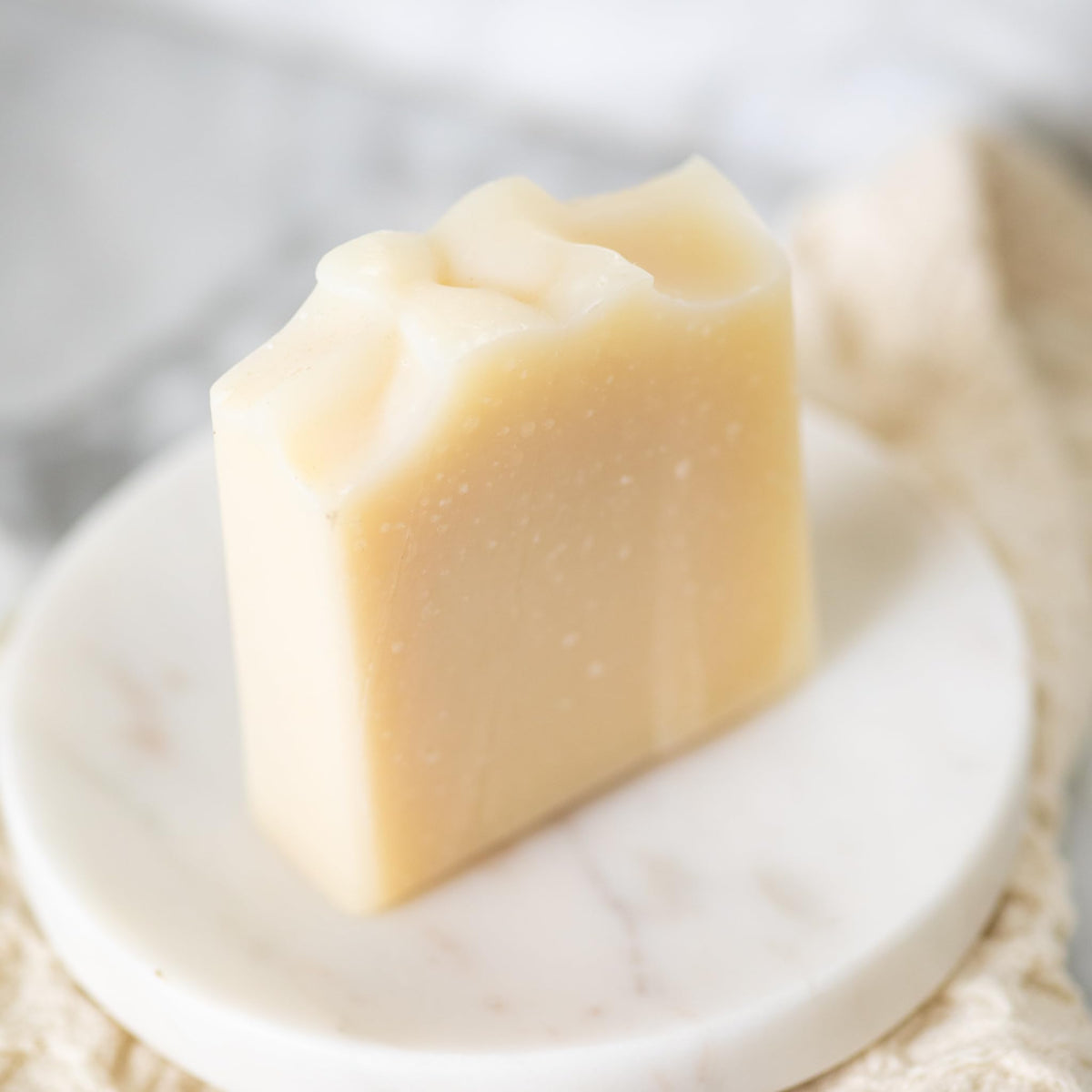 Pretty farm girl close-up texture of soap revealing creamy, moisturizing feel