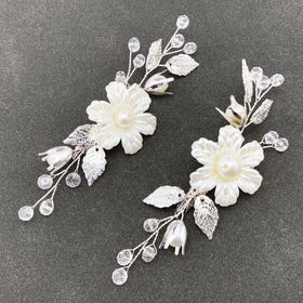 PRETTYLIFE front view of two ivory pearl flower hair clips, elegant accent