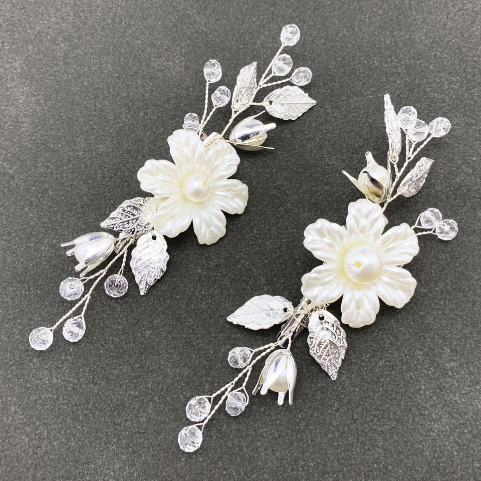 PRETTYLIFE front view of two ivory pearl flower hair clips, elegant accent