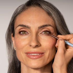 Prime Prometics model applying eyeliner for effortless daily eye definition