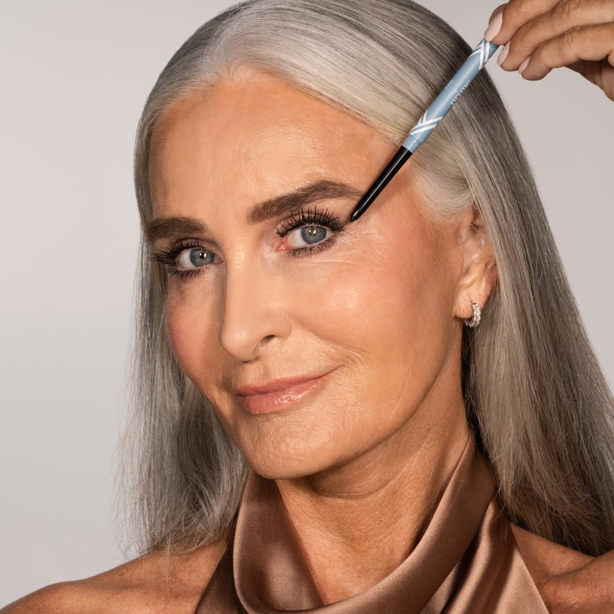PRIME PROMETICS eyeliner tucked inside a makeup bag for travel-ready convenience
