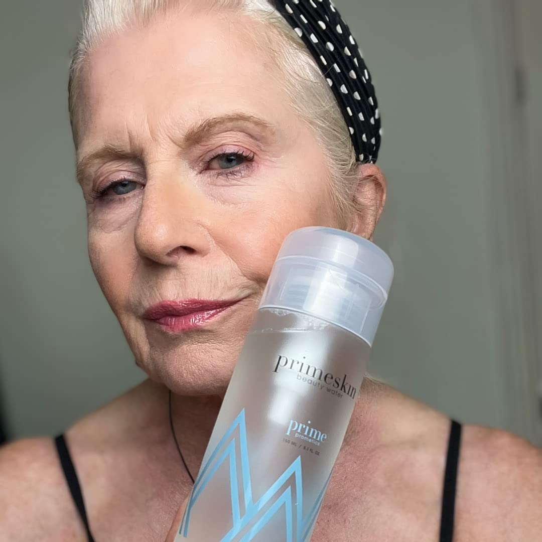 PRIME PROMETICS bottle beside hand for size and scale reference